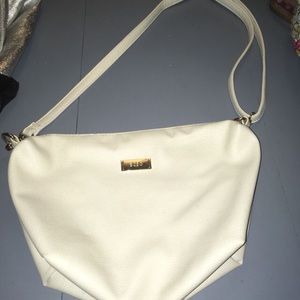 BCBG cream colored handbag.